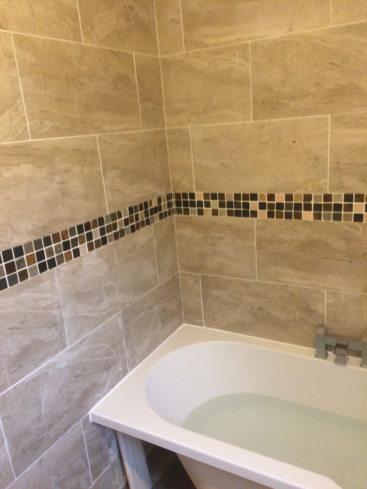 Detailed wall tiling finish by L M Tiling